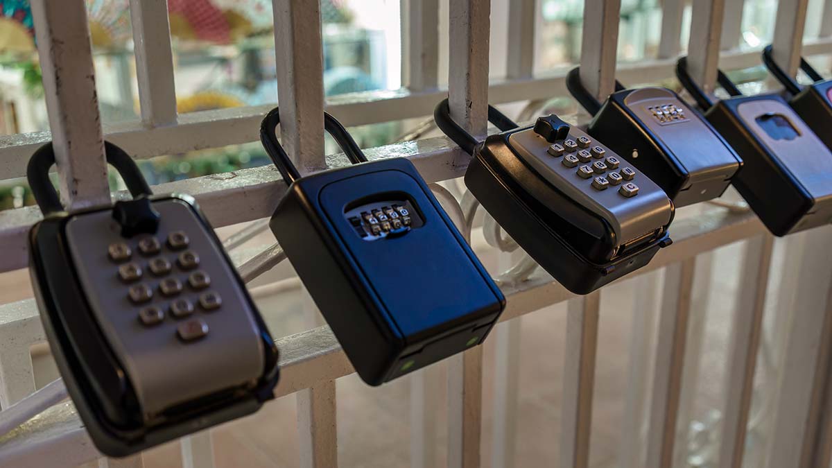 row of key safes attached to railing
