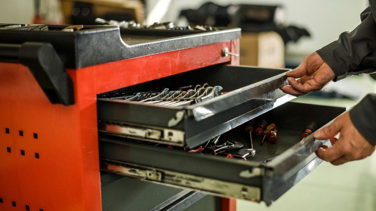 man opening a large tool box