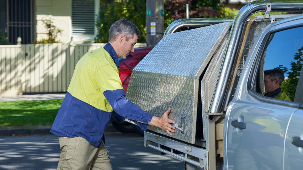 RACV tradie closing his work ute