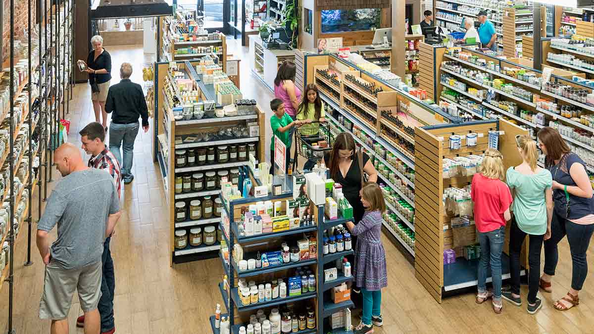 Overhead view of multiple people in health food store.