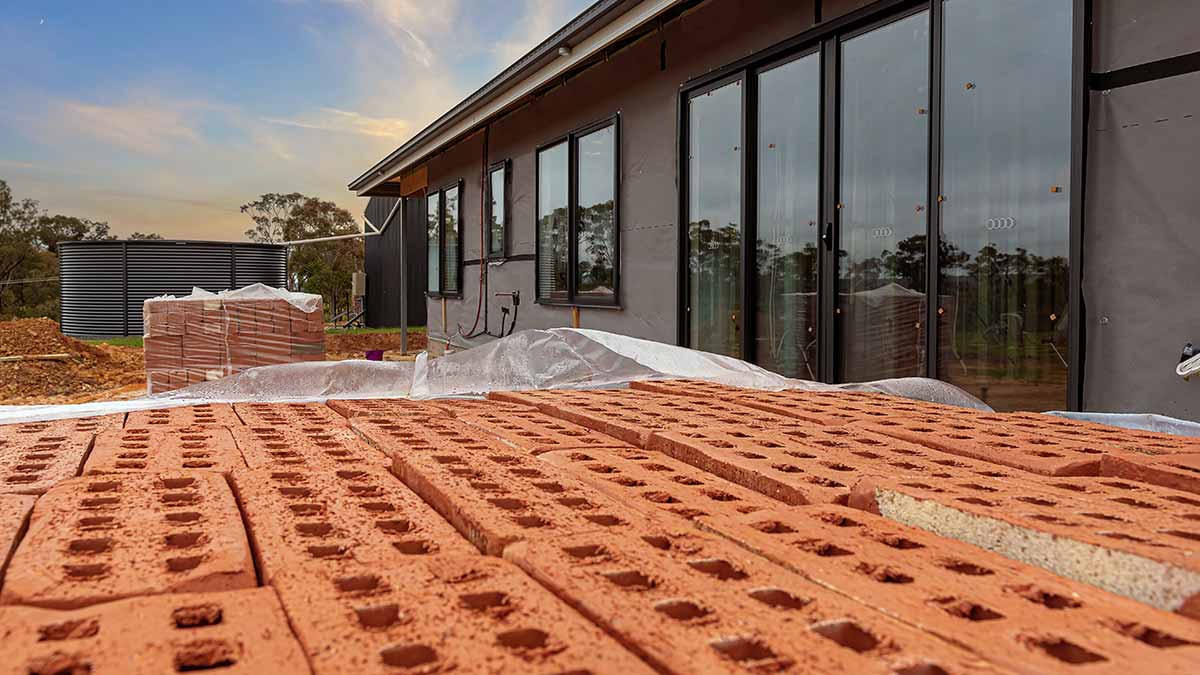 Rows of bricks near house construction