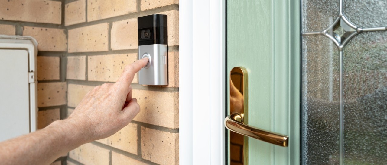 person ringing video doorbell