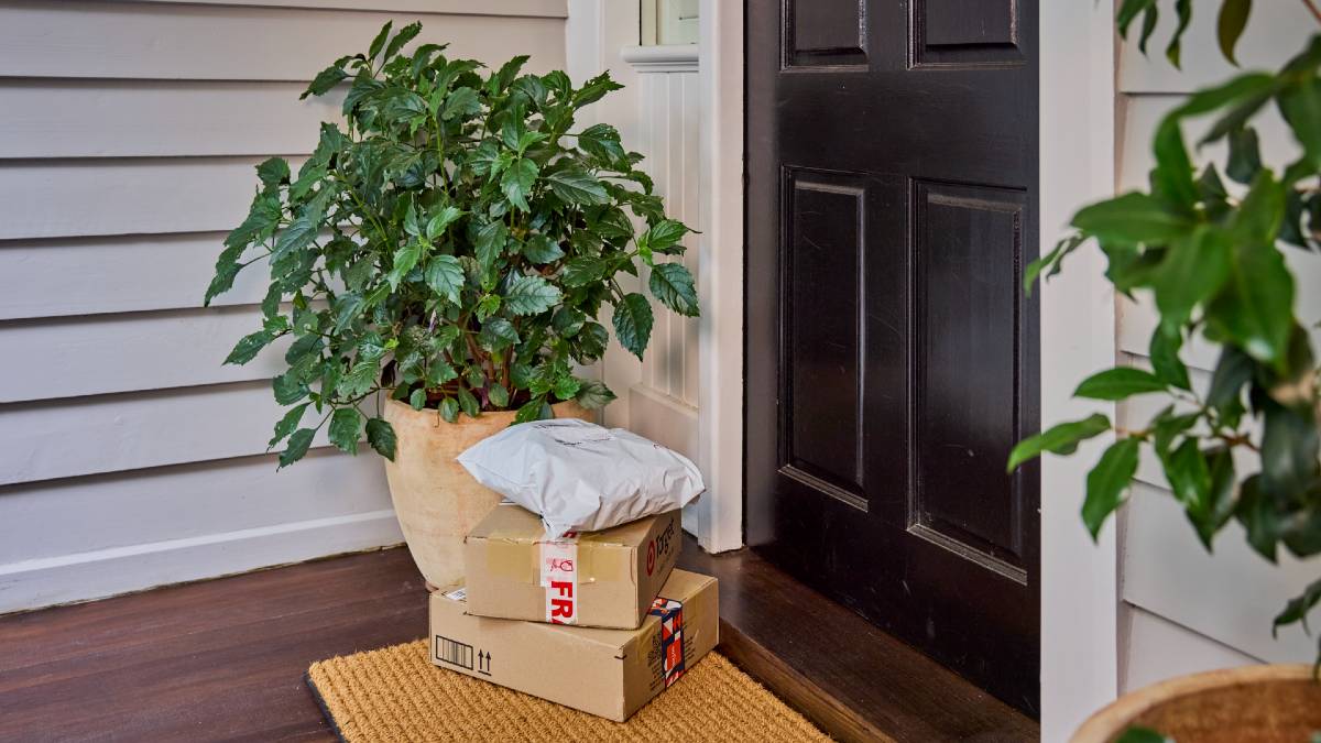 online order packages stacked at front door