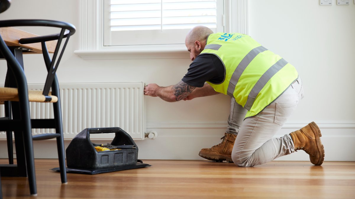 RACV tradie fixing a heater