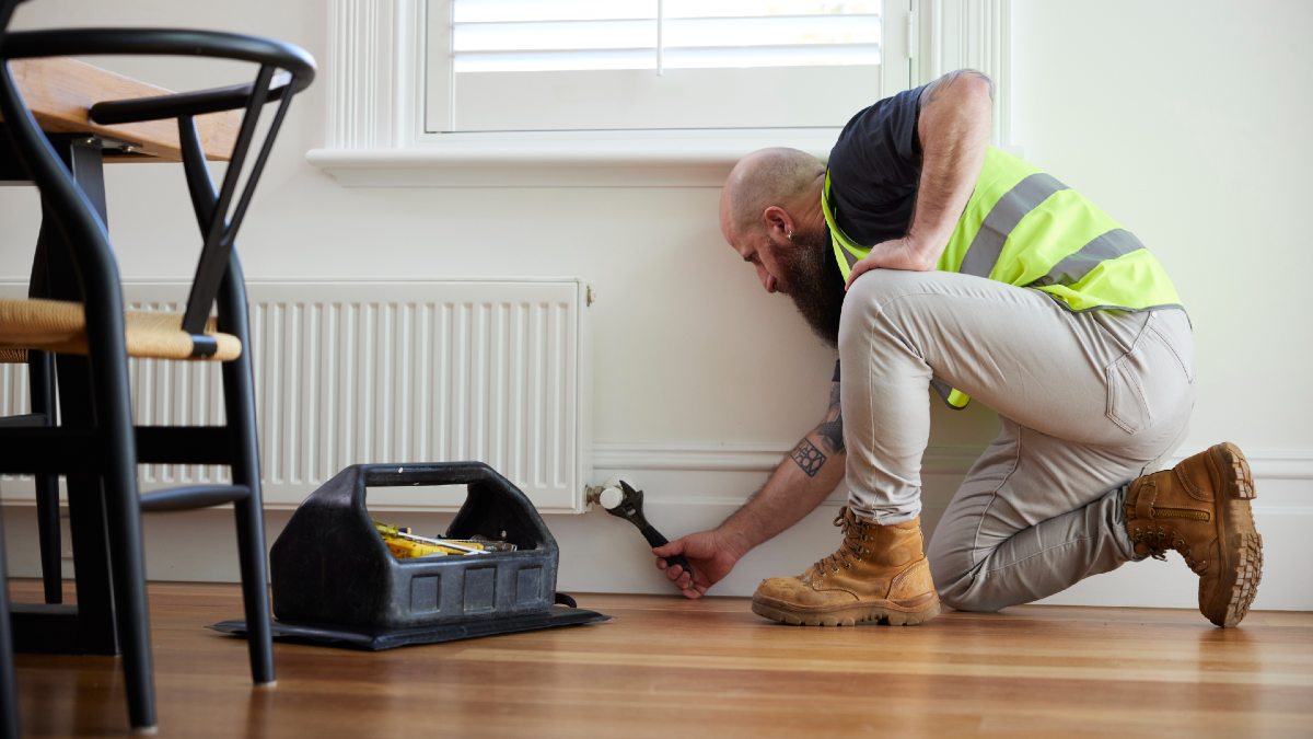 RACV tradie fixing a gas heater