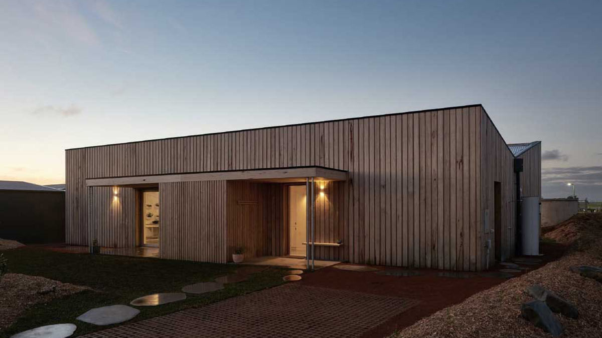 Angled view of Cape House during dusk