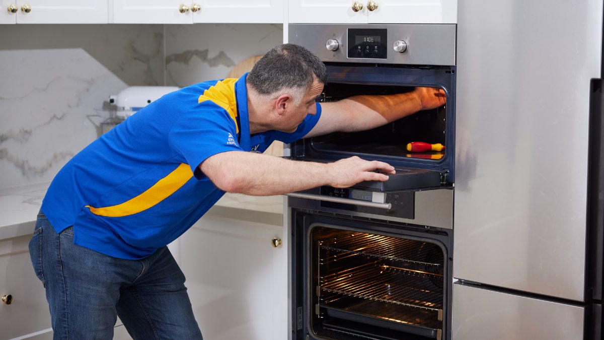 RACV electrician fixing electric oven