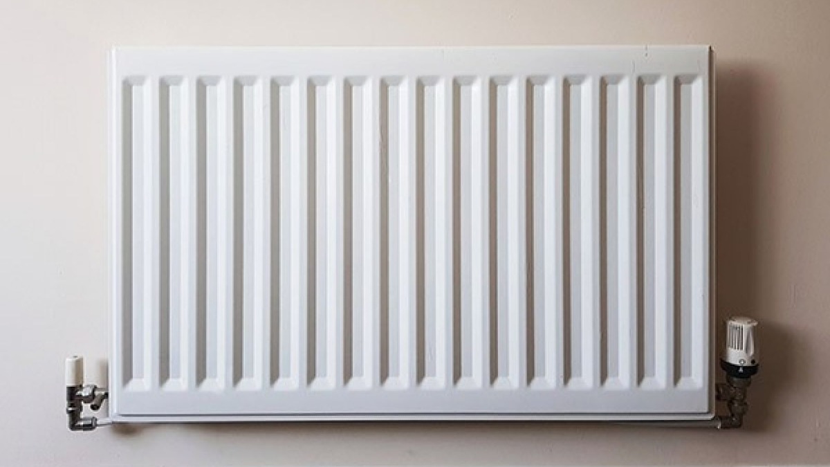 Close-up of white wall heater.