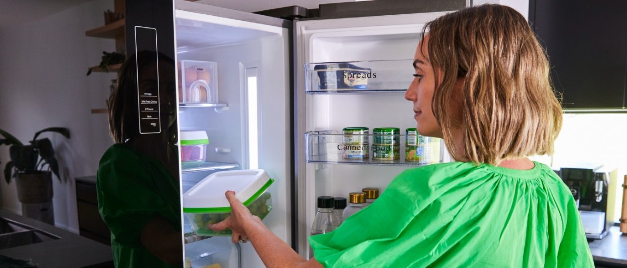 Fridge_Matt Harvey woman putting container in fridge