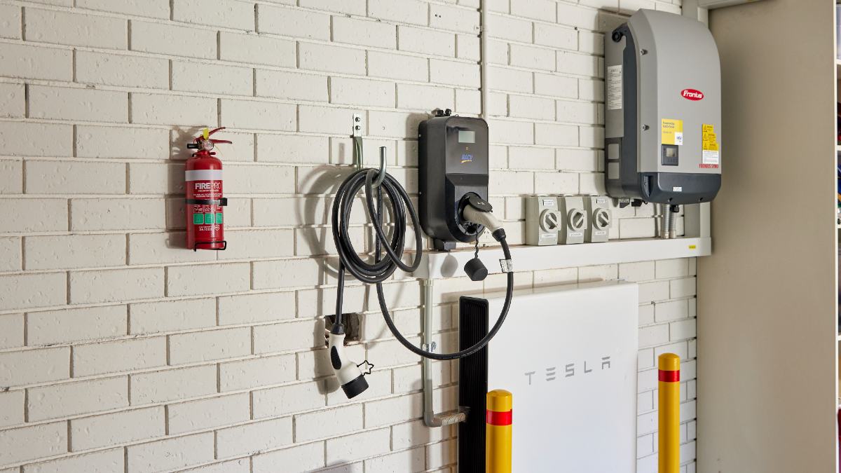 Tesla Powerwall solar battery on garage wall