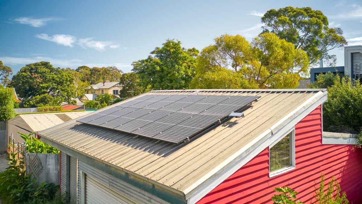 house with rooftop solar panels