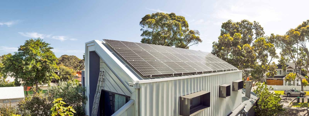 house with rooftop solar panels