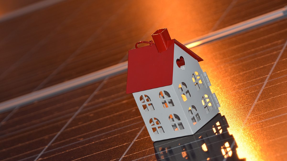 Toy house on solar panels