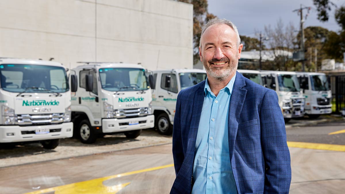 michael stephenson standing in front of nationwide trucks