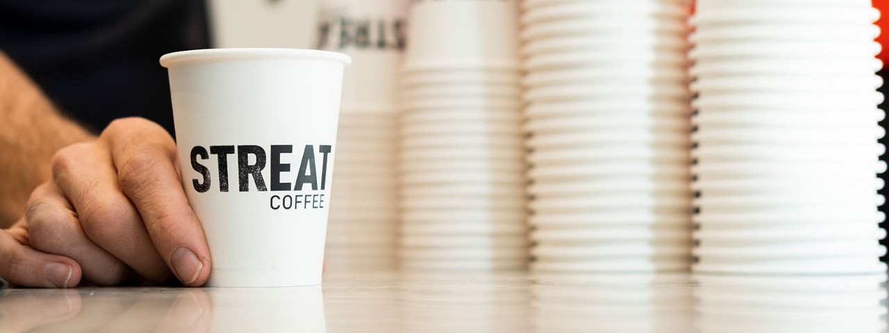 Streat coffee cup on bench