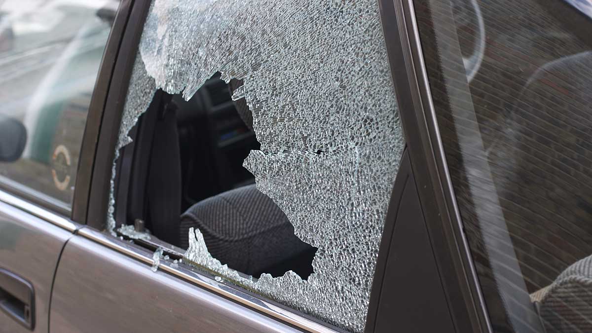 black car with smashed rear left window