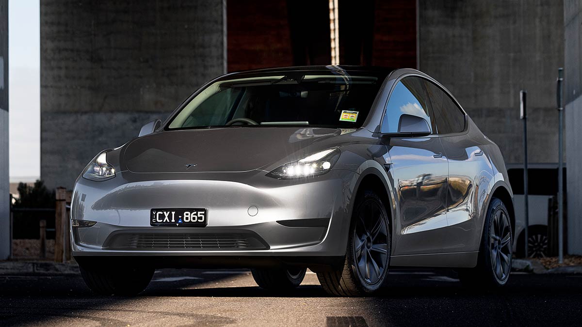 Silver Tesla Model Y under Bolte Bridge in Melbourne