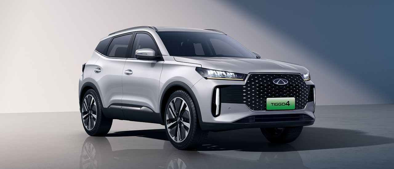 Frontal shot of silver metallic Chery Tiggo 4 Hybrid small SUV in studio with blue shadows