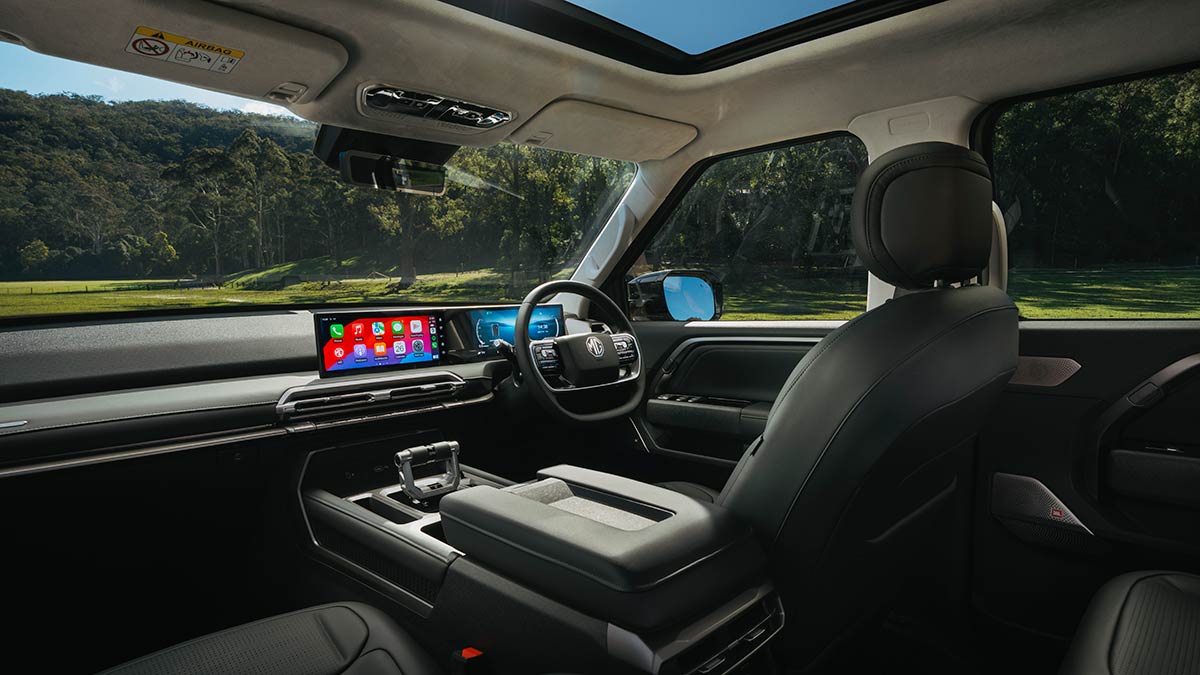 Spacious interior of MG U9 ute pictured from rear seat through to dashboard with digital screens.