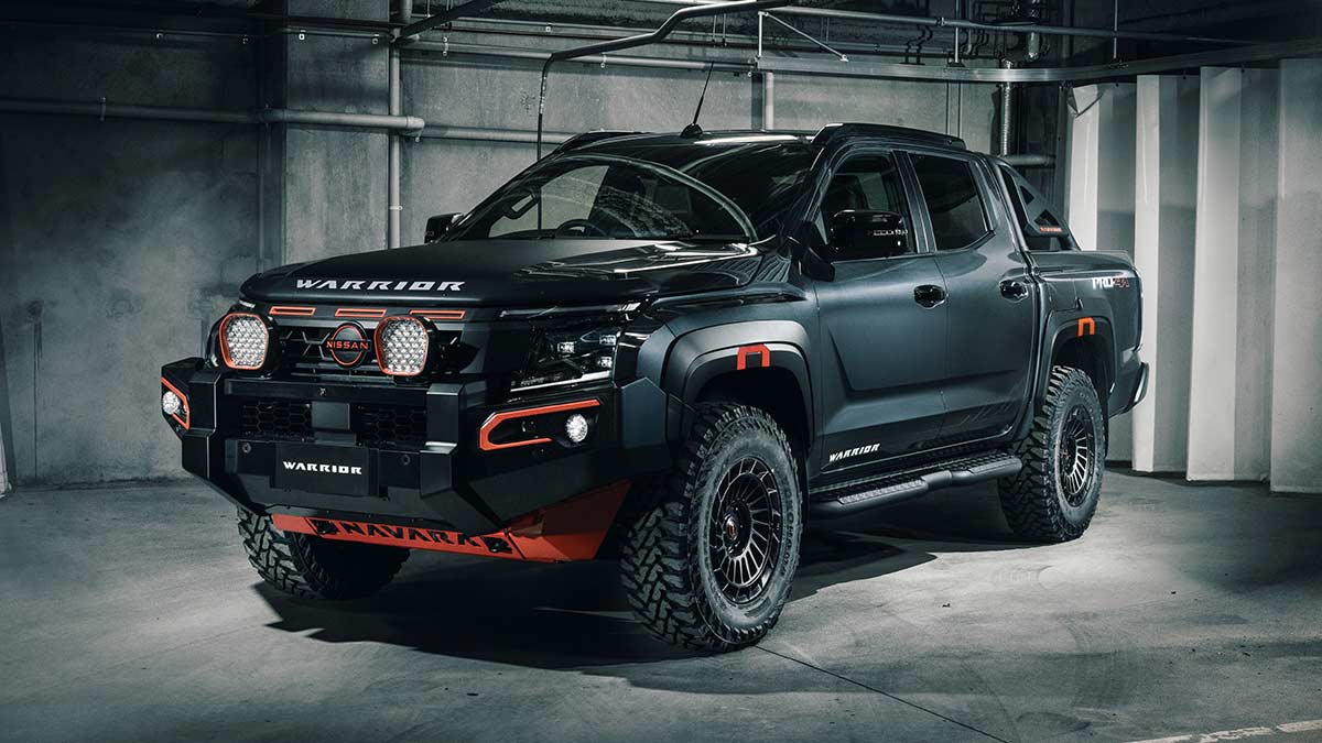 Black 2026 Nissan Navara Warrior ute concept in dark underground carpark with pipes running overhead and on walls.