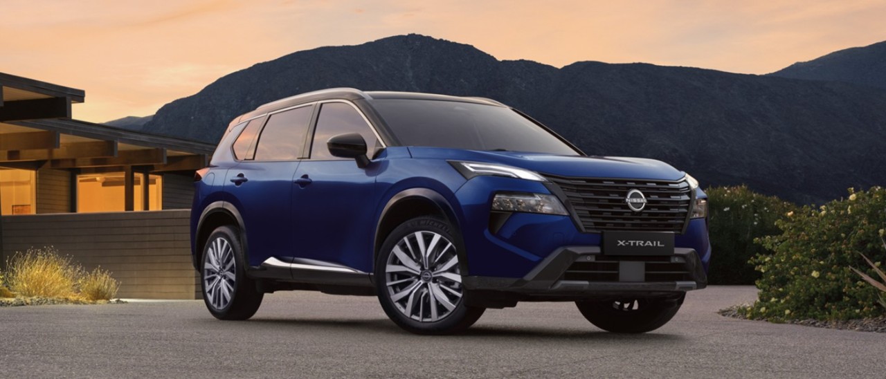 dark blue 2026 Nissan X-Trail parked on driveway