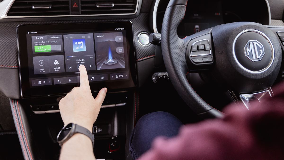 hand touching in-built device in car