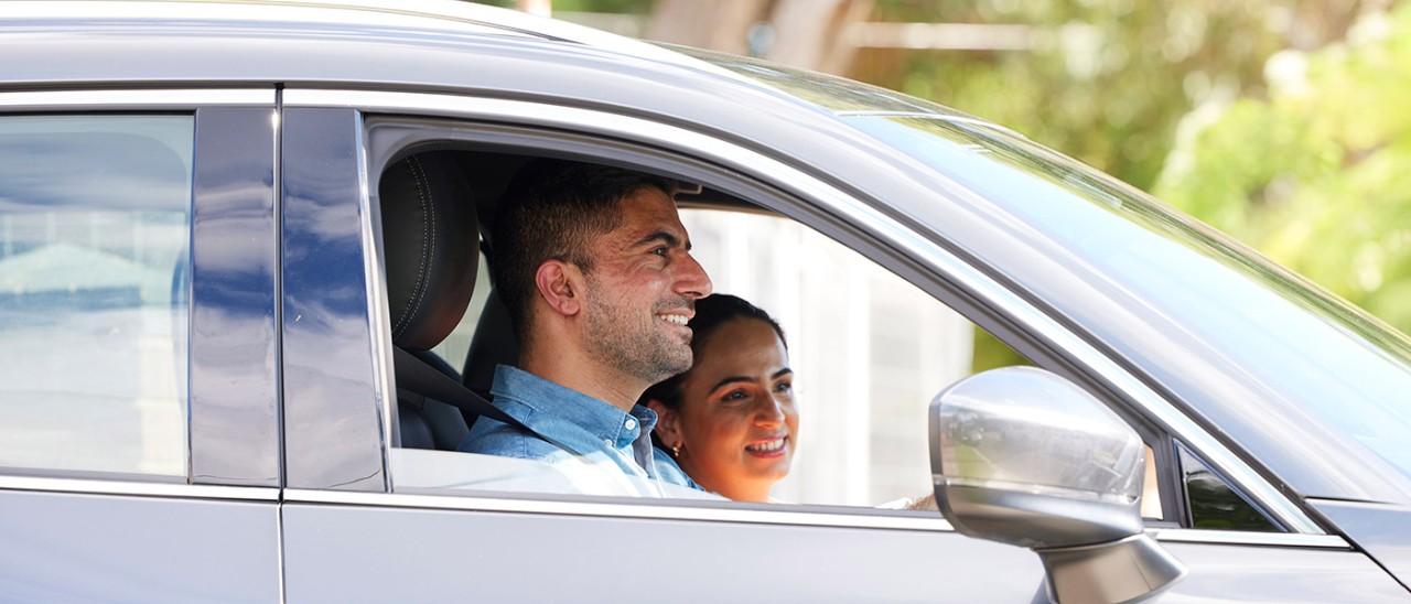 Couple driving in car.