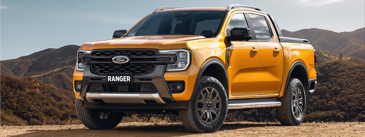 A Ford Ranger Wildtrak parked on a gravel road.
