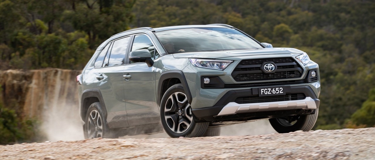 Toyota-RAV4-Edge-AWD-banner-1400x600 Toyota RAV4 Edge medium SUV in ‘jungle khaki’ colour at top of steep off-road incline in quarry