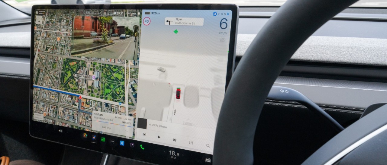 A close-up of the 2026 Tesla Model Y infotainment screen while the vehicle is in full self-driving (supervised) mode