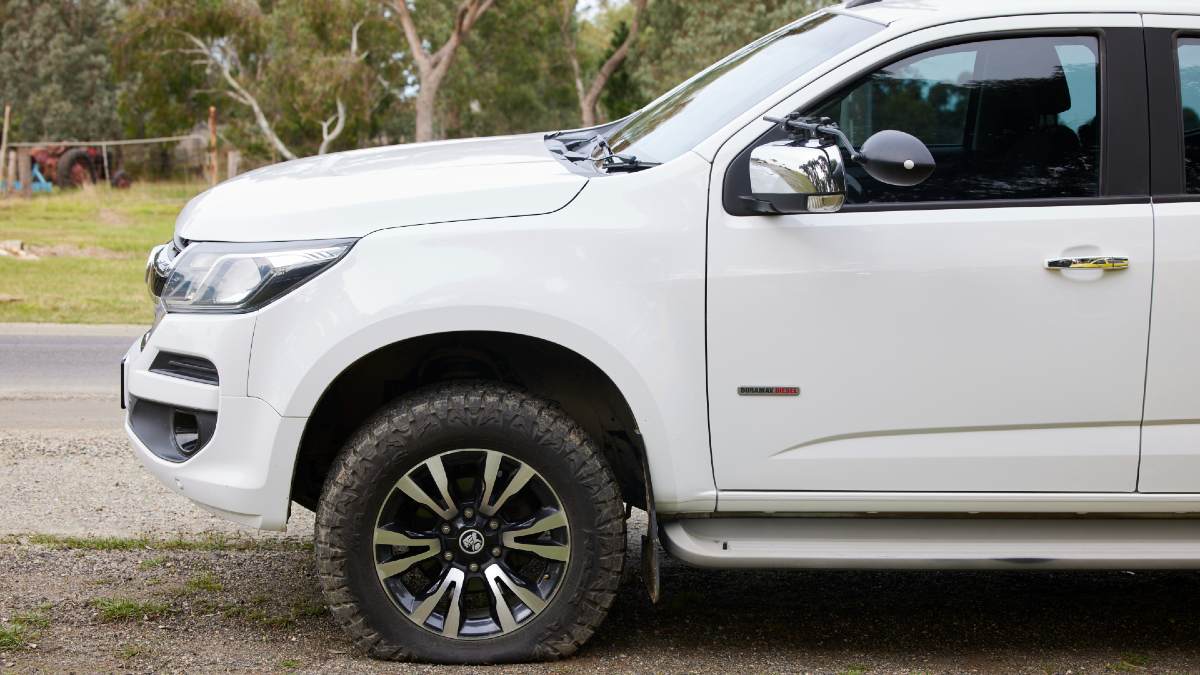 white ute with flat front tyre