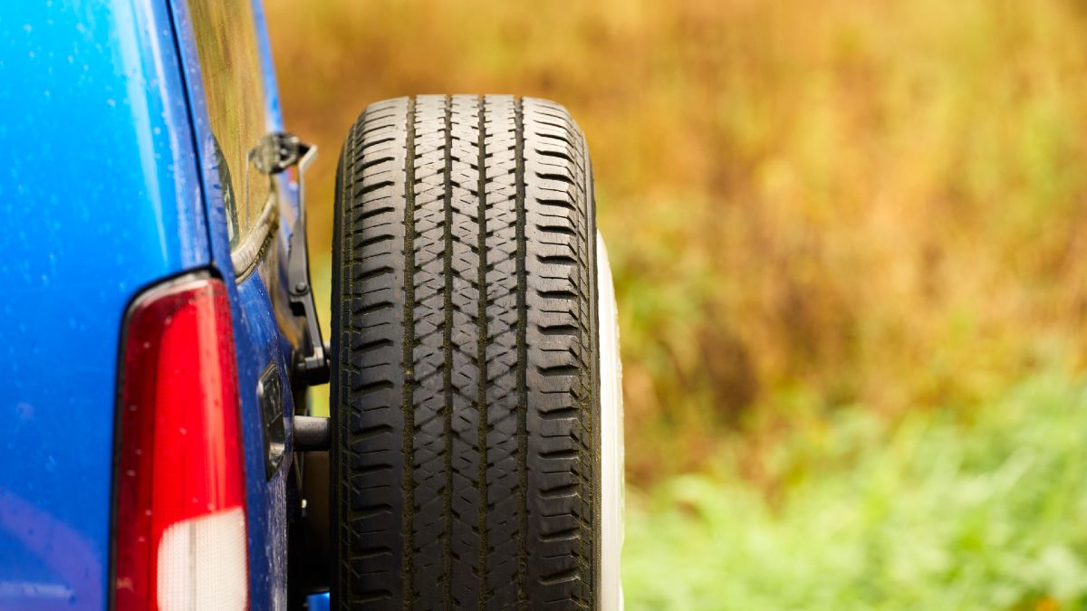spare tyre on the back of a blue SUV