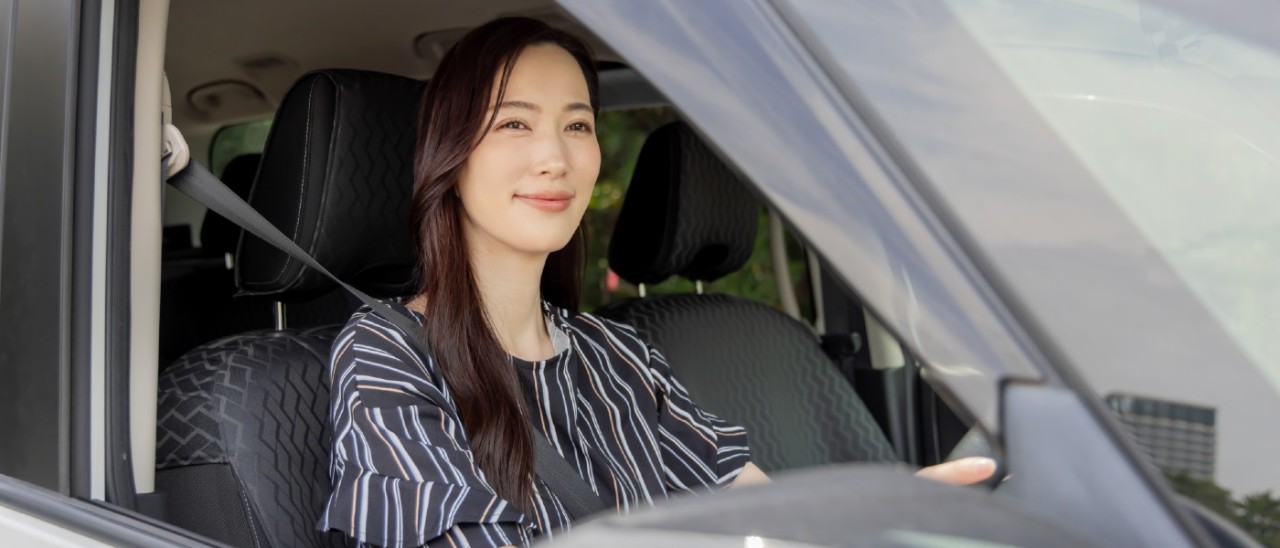 young woman driving car