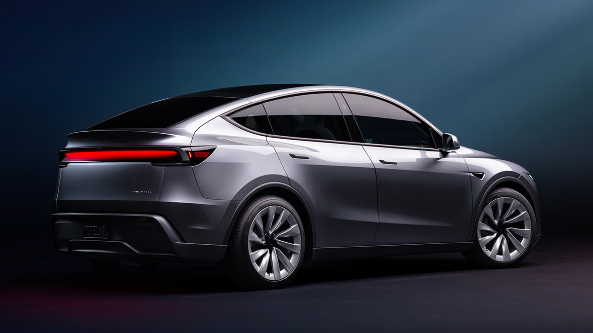 Rear view of silver Tesla Model Y in studio