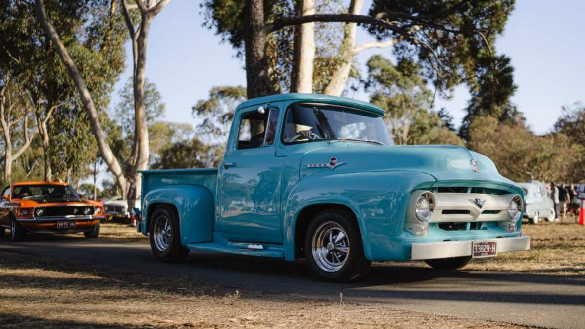 blue Ford truck at car show