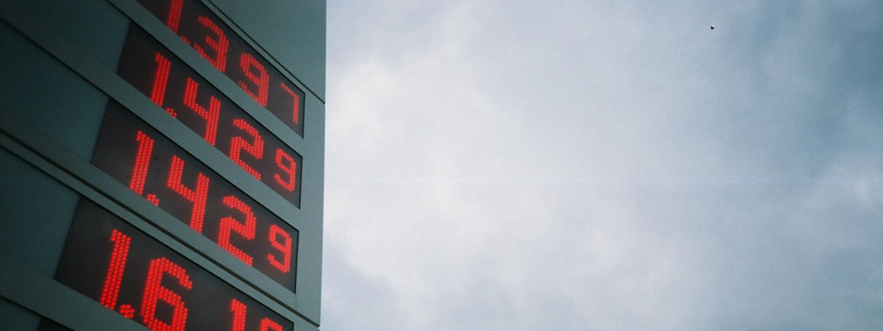 Petrol station sign with sky in background