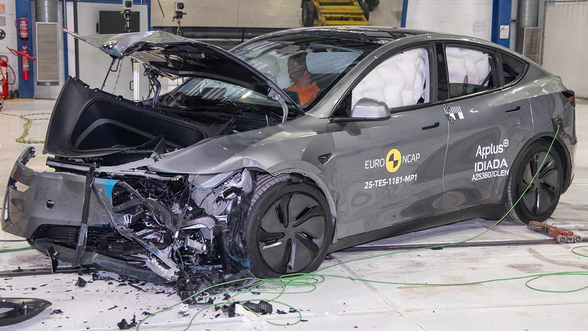 Grey Tesla Model Y EV with severely damaged front end after NCAP crash test in Europe. 
