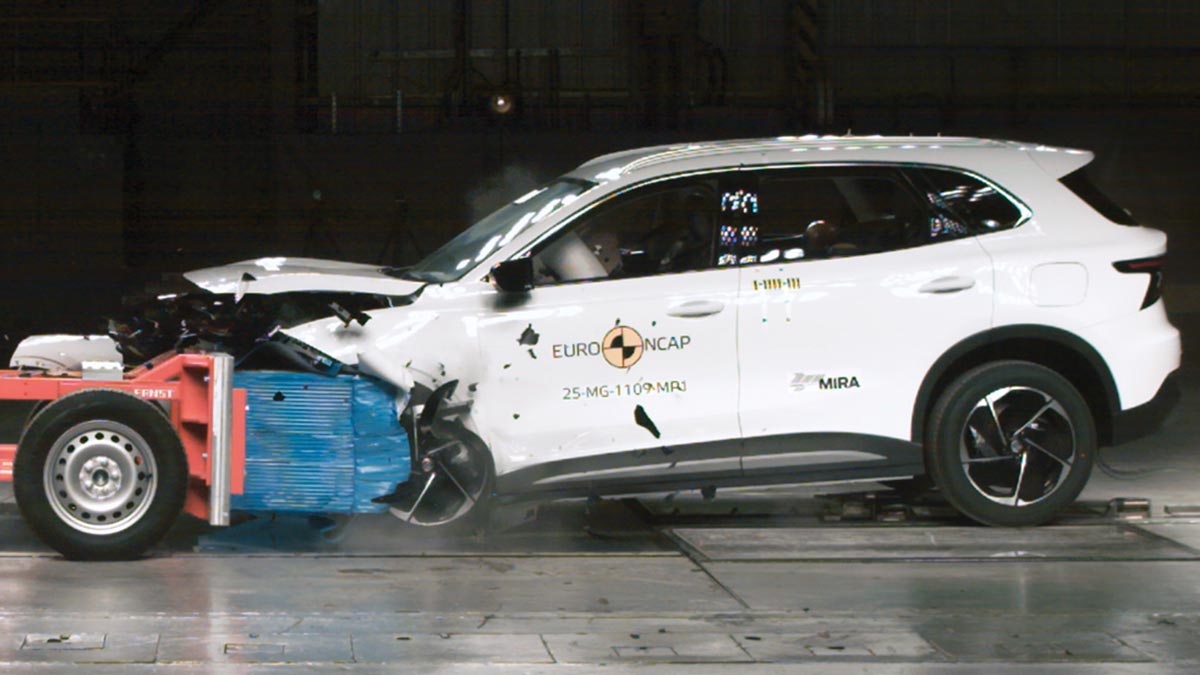 White MG S5 EV crashing into deformable barrier in frontal offset Euro NCAP test.