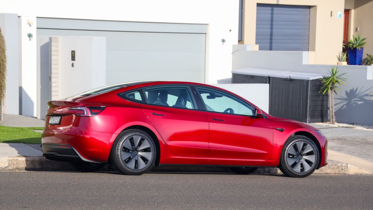 red 2024 Tesla Model 3 RWD parked