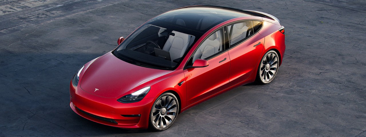 Stationary red 2022 Tesla Model 3