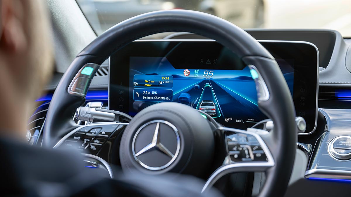 Steering wheel and instrument panel in Mercedes-Benz EQS showing SAE Level 3 Drive Pilot automated driving system.