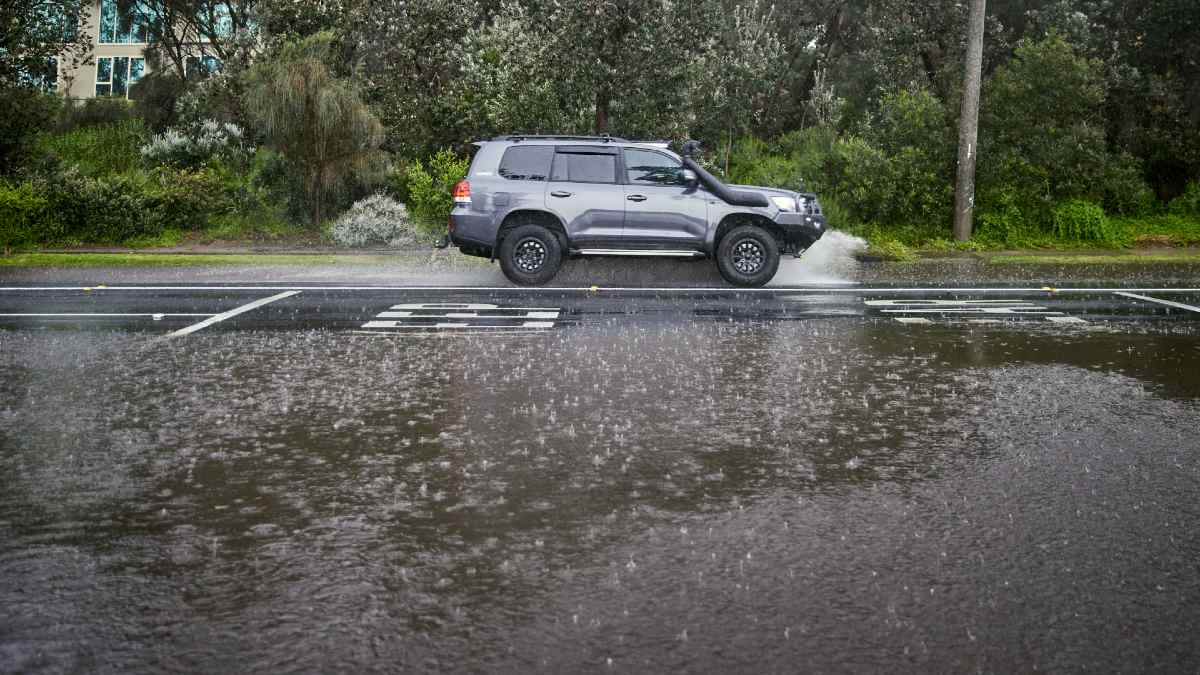 car driving on semi-flooded road