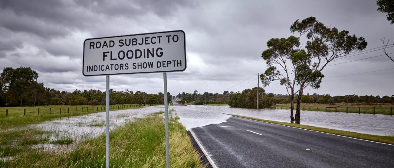 Flooded Road_Matt Harvey flooded road with road sign saying Road subject to flooding