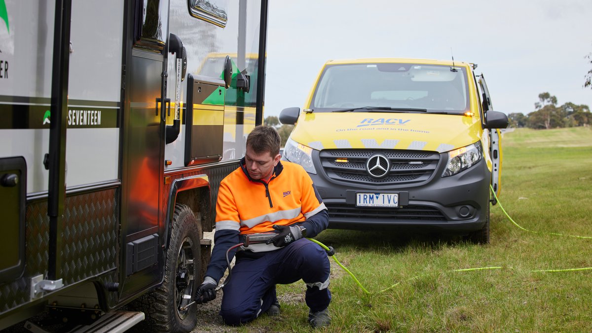 RACV roadside assistance van helping a broken down ute