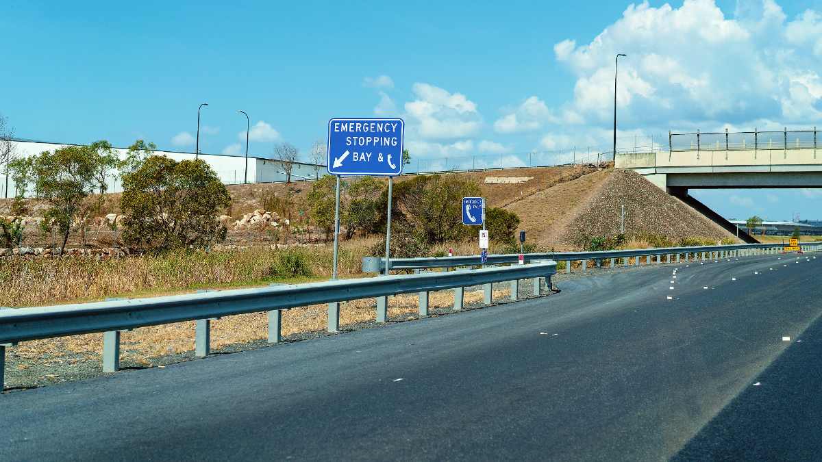 emergency stopping bay sign on road