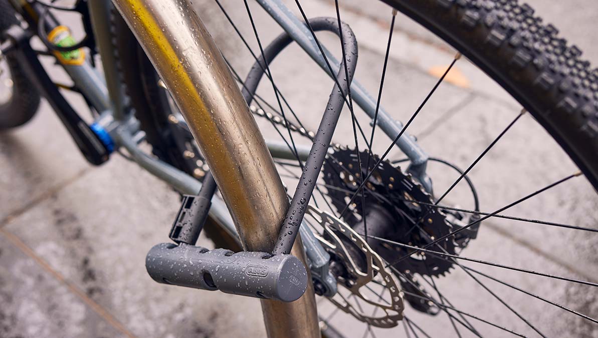 A bike locked to a bicycle hoop