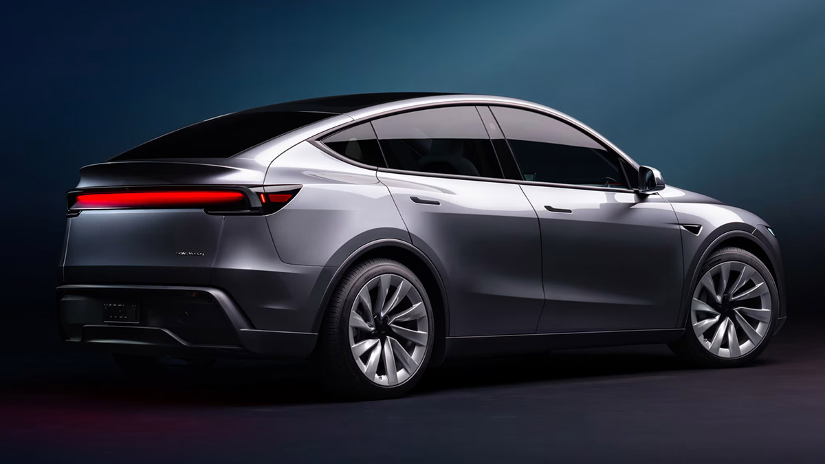 Rear shot of 2025 Tesla Model Y electric SUV showing full-width light bar