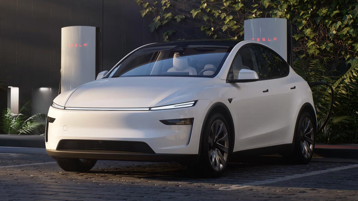 White Tesla Model Y EV at charging station