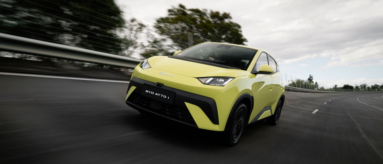 lime green 2026 BYD Atto 1 driving on road