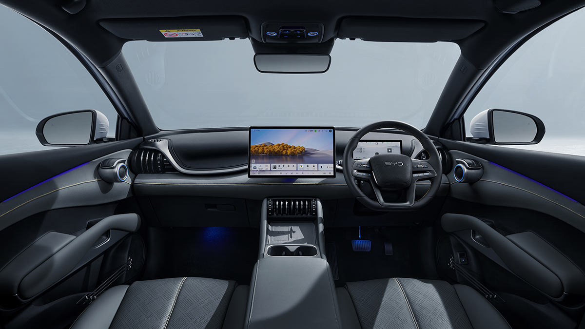 BYD Atto 3 Dynamic SUV cabin with dark grey trim and redesigned dashboard and centre console with less switchgear and dual digital screens.